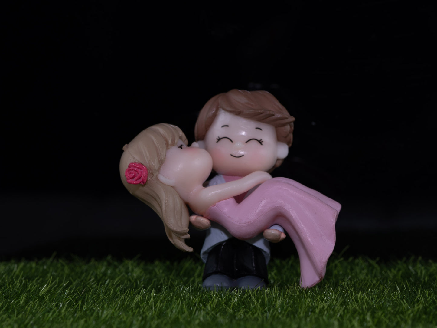 Boy holding girl in arm miniature