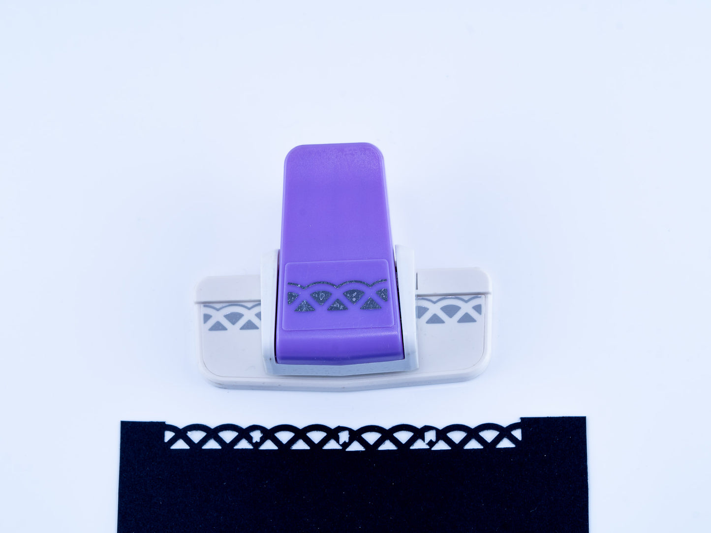 Semi triangular border punch