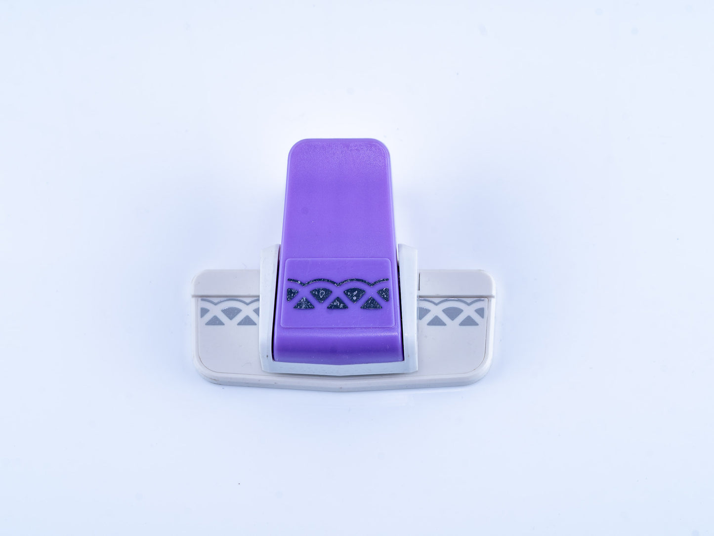 Semi triangular border punch